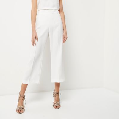 White cropped wide leg trousers